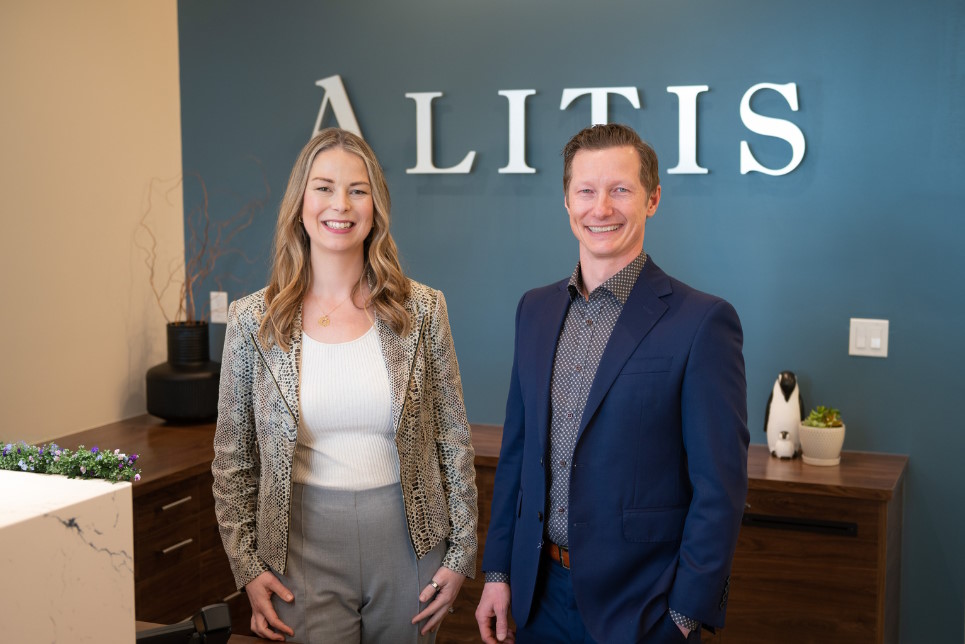 Emily and Shawn in front of Alitis sign