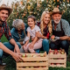 Farming family in orchard with apples