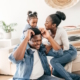 Young couple playing with toddler daughter