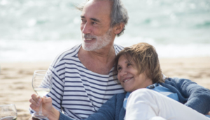 retired couple on beach