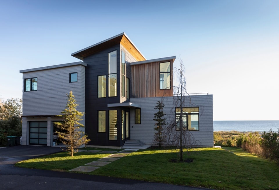 Oceanfront cottage under blue sky