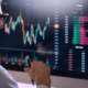 Man looking at stock market graphs and charts