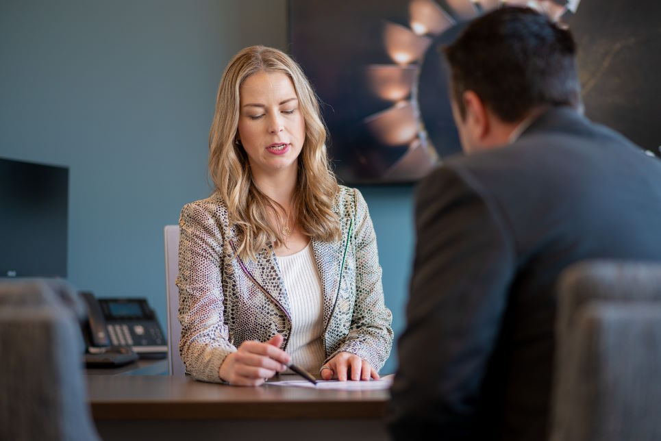 Portfolio manager speaking with client