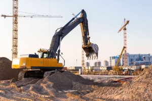 Excavator digging holes for development